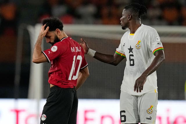 Egypt’s Mohamed Salah, left, leaves the field after sustaining an injury during the African Cup of Nations Group B soccer match between Egypt and Ghana (Themba Hadebe/AP)