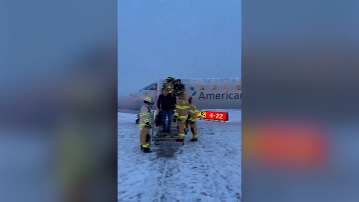 <p>Watch: American Airlines plane carrying 53 passengers skids off icy New York airport runway.</p>