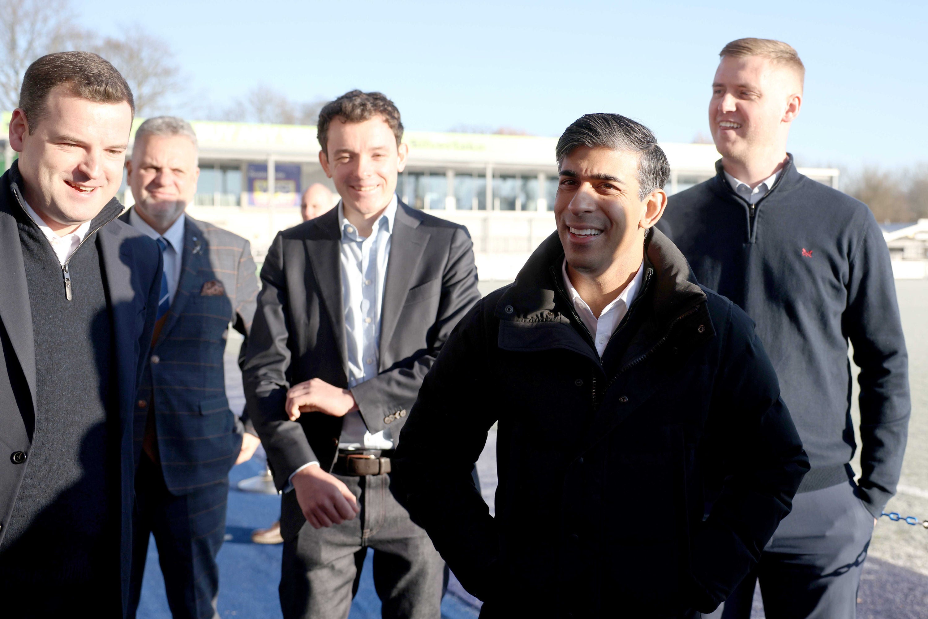 Prime minister Rishi Sunak (second right) speaks with Eastleigh FC players and staff