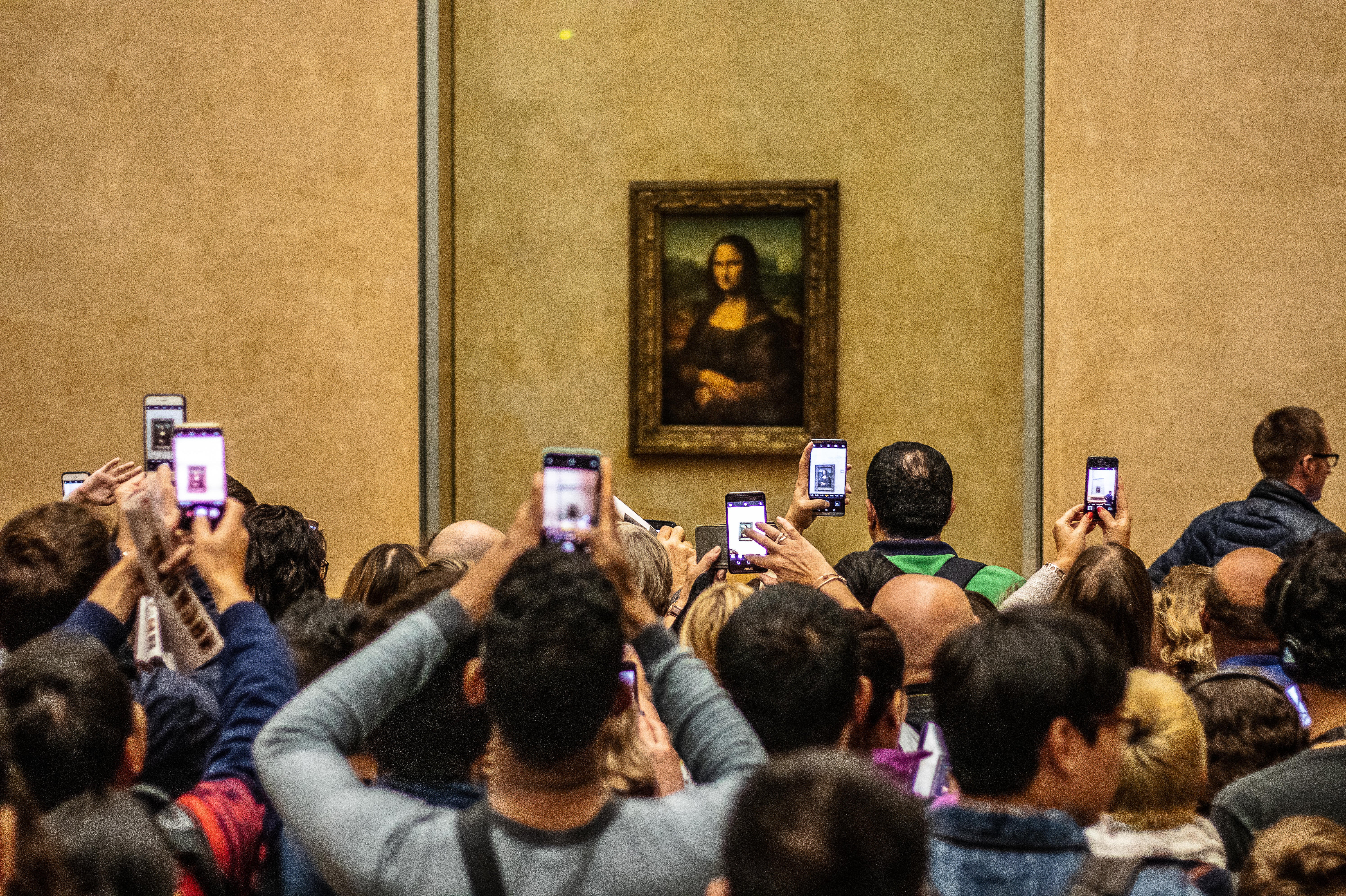 Phone-a Lisa: individuals refusing to experience the famous artwork unless it’s through their screens