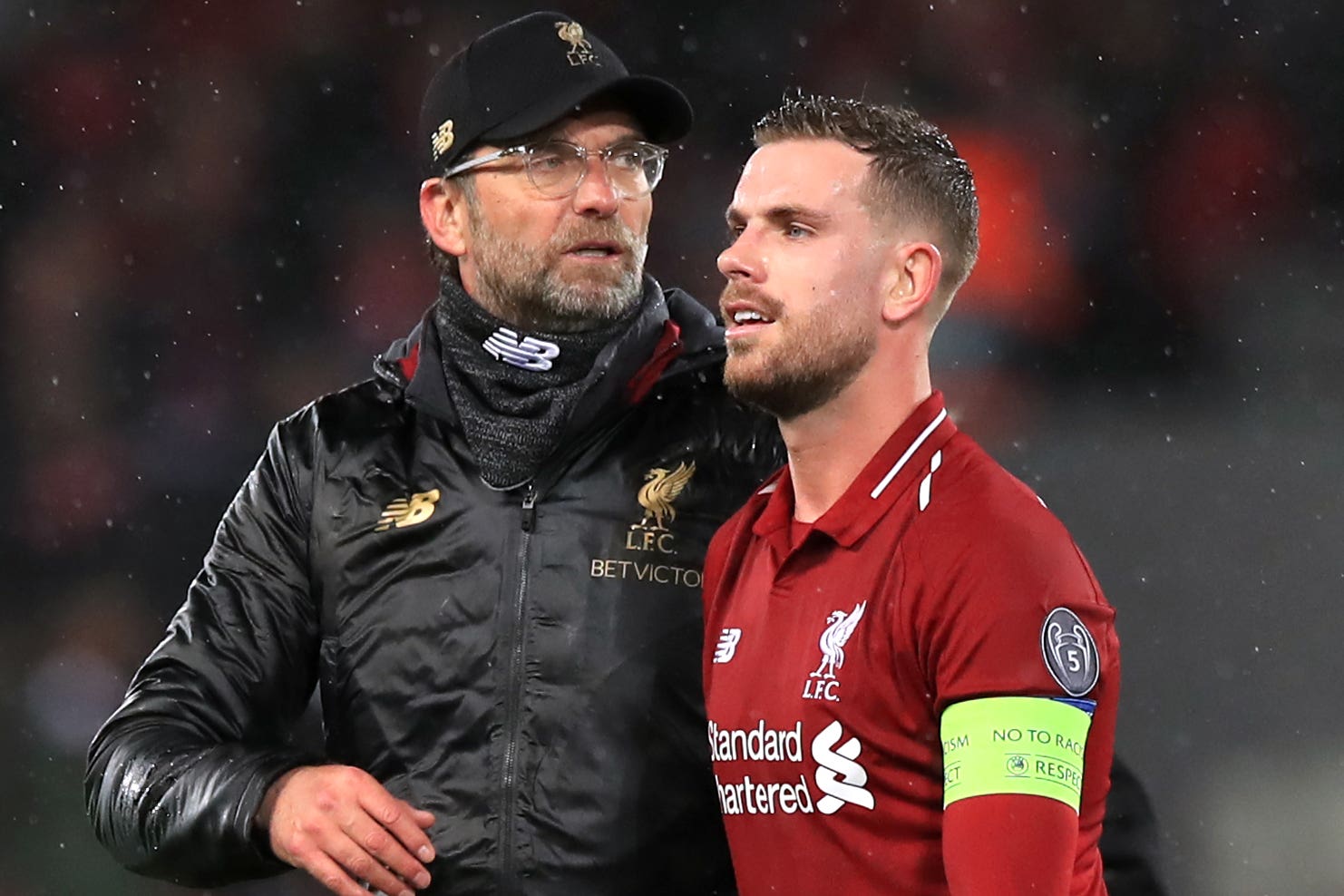 <p>Liverpool manager Jurgen Klopp with his former captain Jordan Henderson (Peter Byrne/PA)</p>