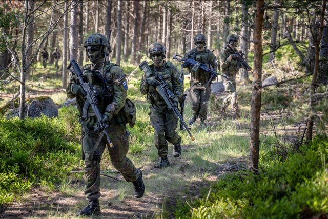 <p> Swedish and Finnish soldiers perform war simulation drills as part of Nato military exercises with its partners</p>
