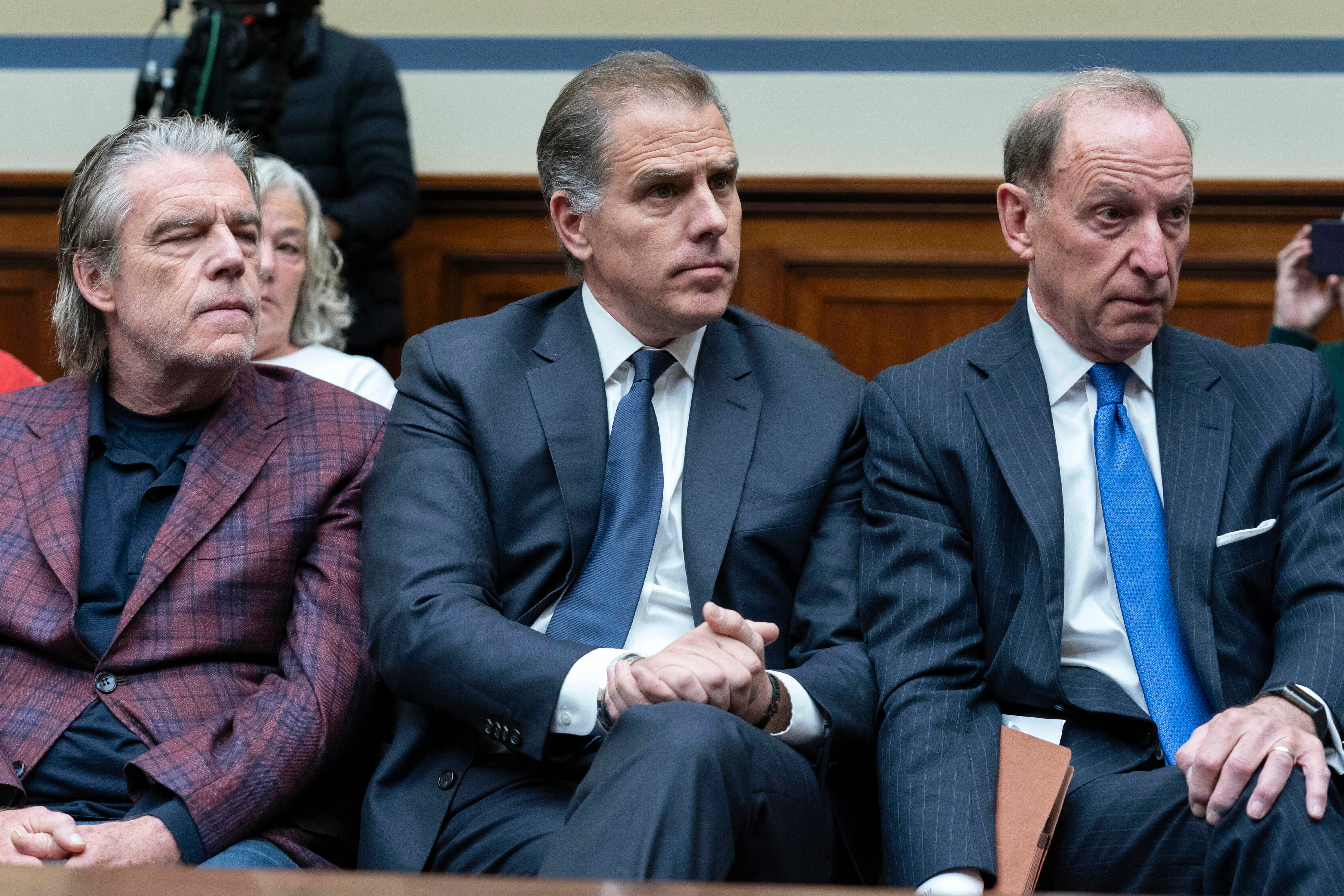 Attorney Kevin Morris, left, sits next to Hunter Biden, President Joe Biden’s son, centre, and Mr Biden’s attorney Abbe Lowell, right, sit in the front row at a House Oversight Committee hearing as Republicans are taking the first step toward holding him in contempt of Congress on 10 January 2024 on Capitol Hill in Washington