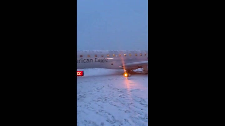 American Airlines plane slips off snowy runway after New York