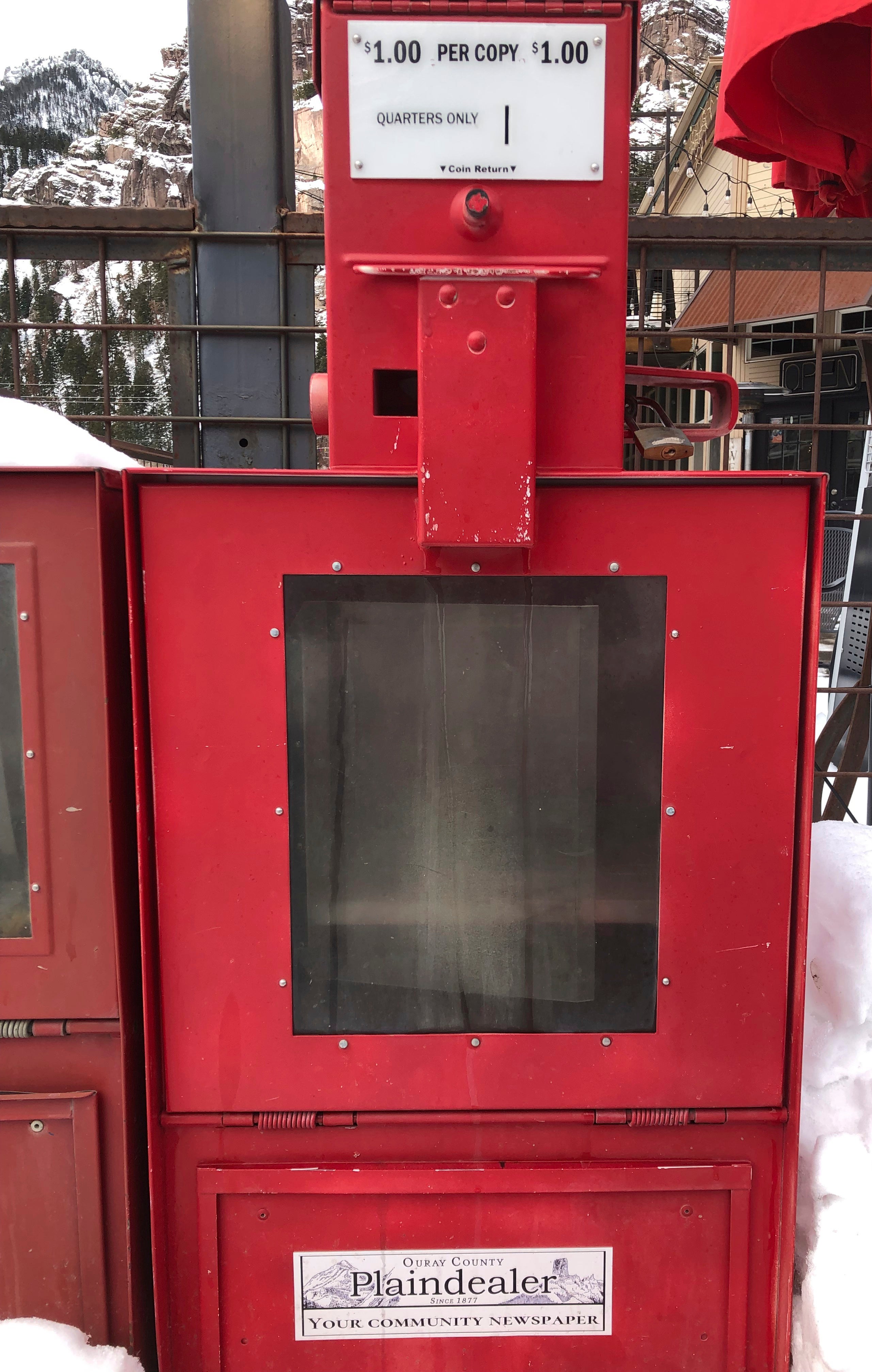 An empty newspaper rack for the Ouray County Plaindealer is show on Thursday