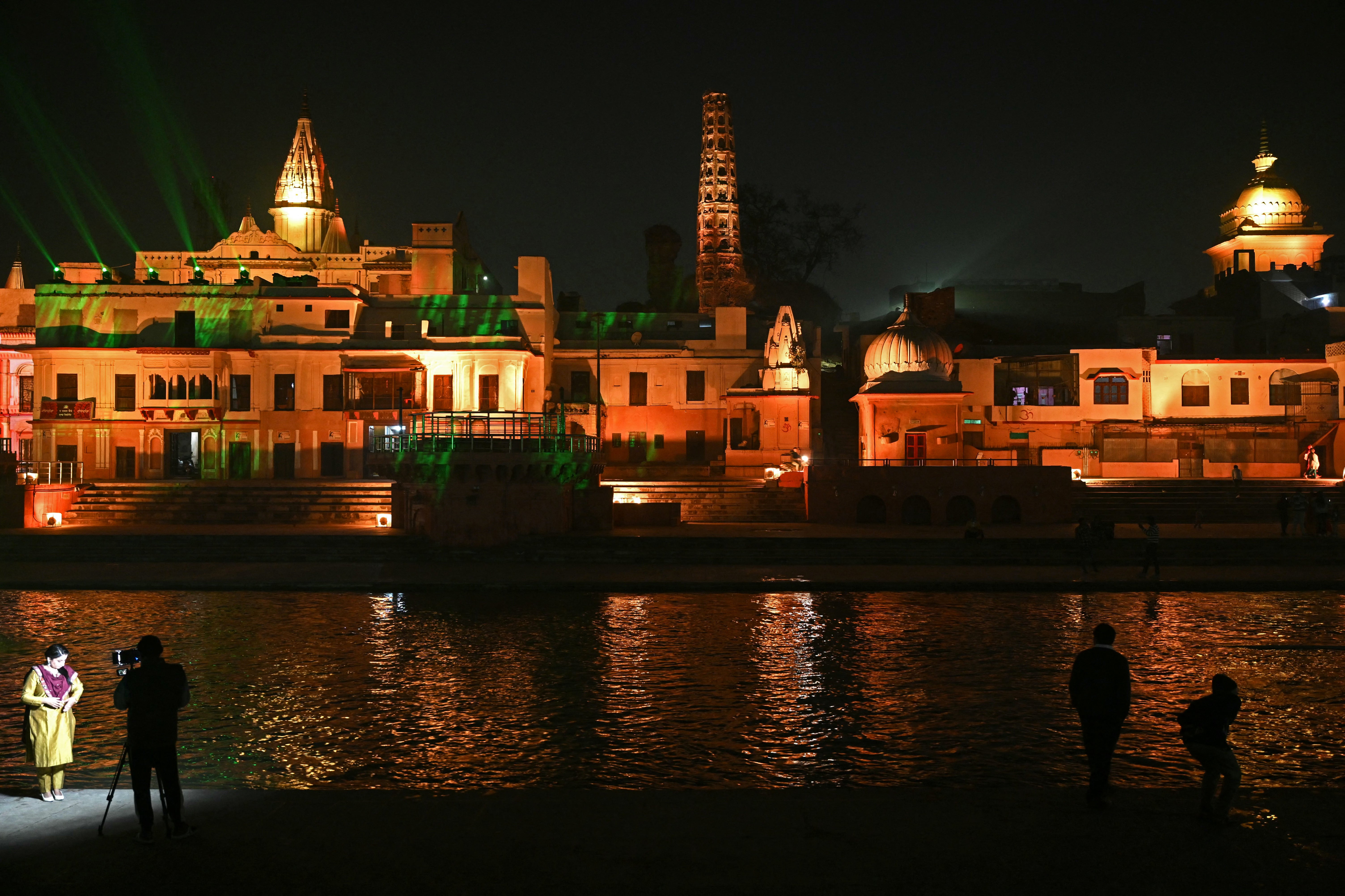 Devotees watch a light and sound show at a Hindu temple on the banks of the River Sarayu in Ayodhya, believed to be the birthplace of Ram