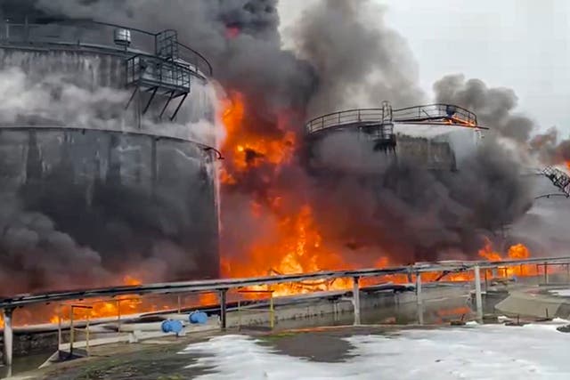 <p>Russian firefighters extinguishing a fire following a reported drone attack on the territory of the Klintsevskaya oil depot, near Bryansk</p>