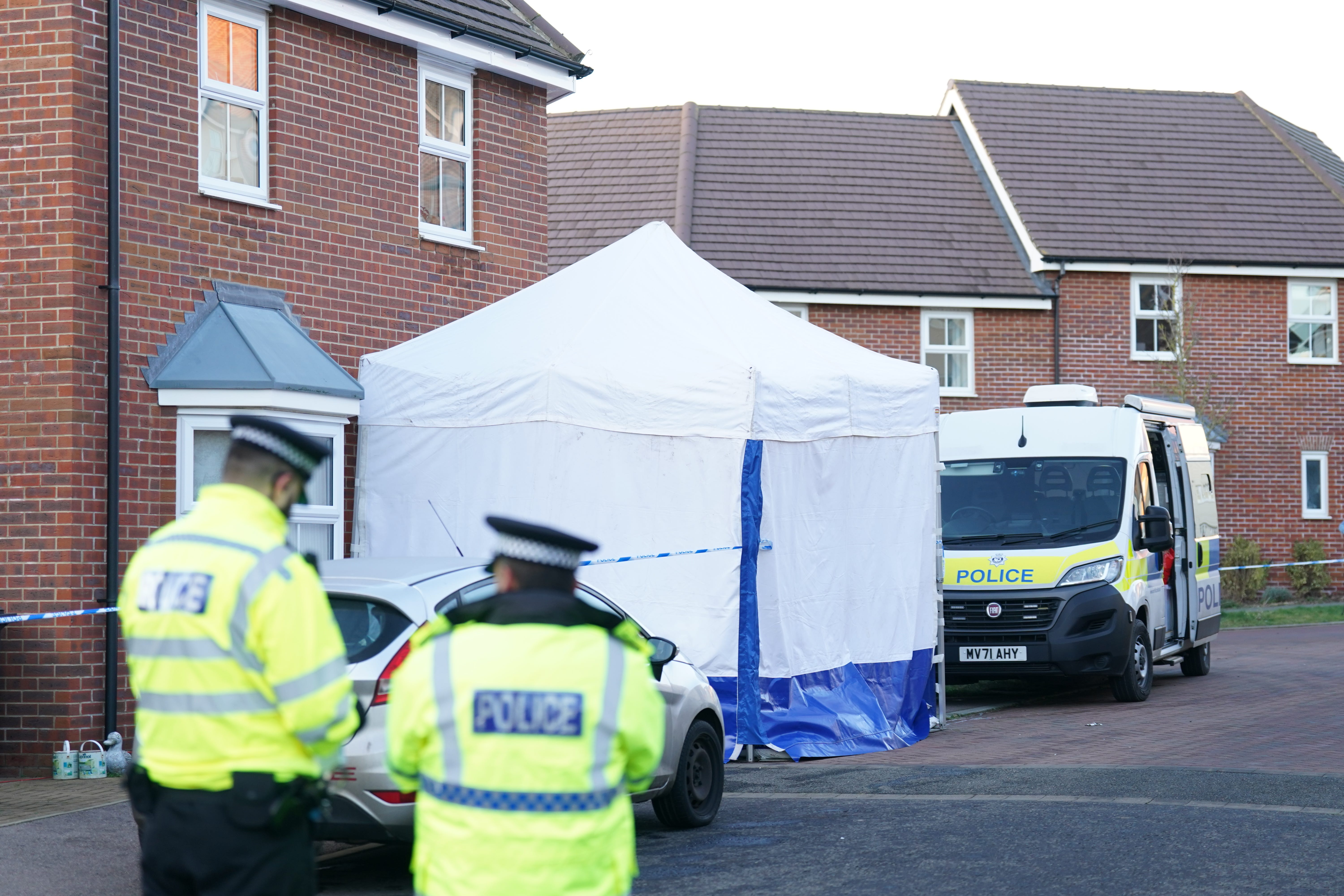 Police outside a house in Costessey near Norwich after four people were found dead inside the property (Joe Giddens/PA)