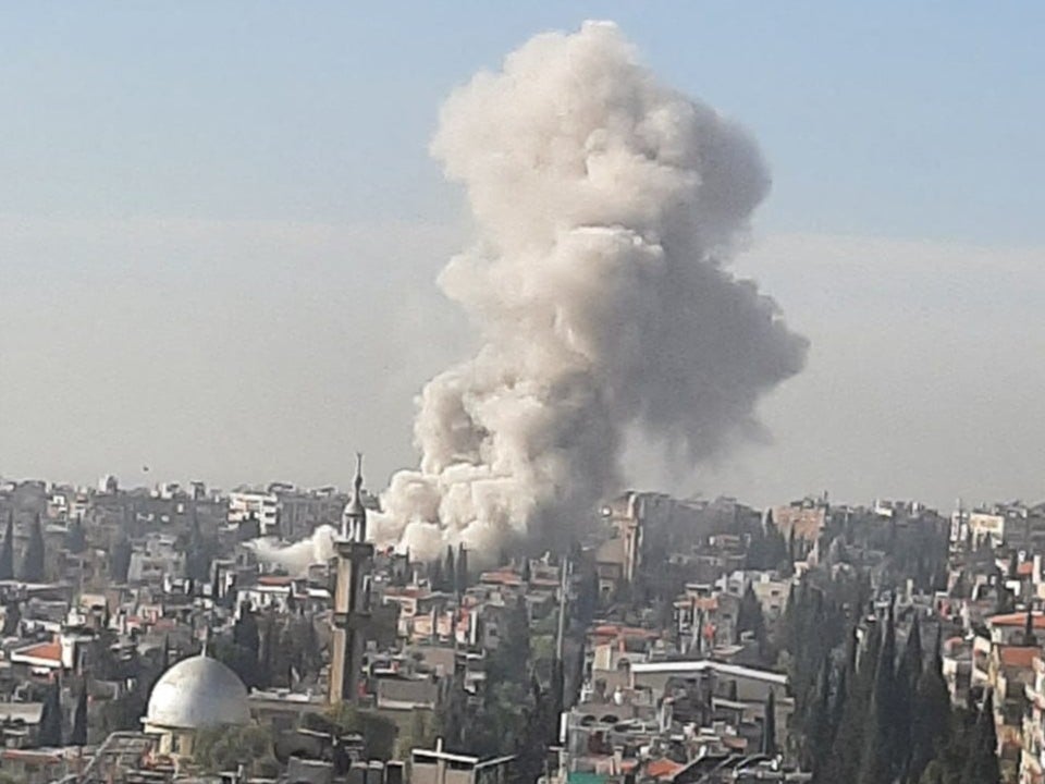 Dramatic video shows a towering column of smoke rising above Damascus following the airstrike which has been blamed on Israel