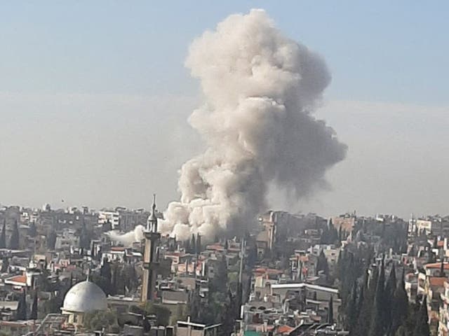 <p>Dramatic video shows a towering column of smoke rising above Damascus following the airstrike which has been blamed on Israel</p>
