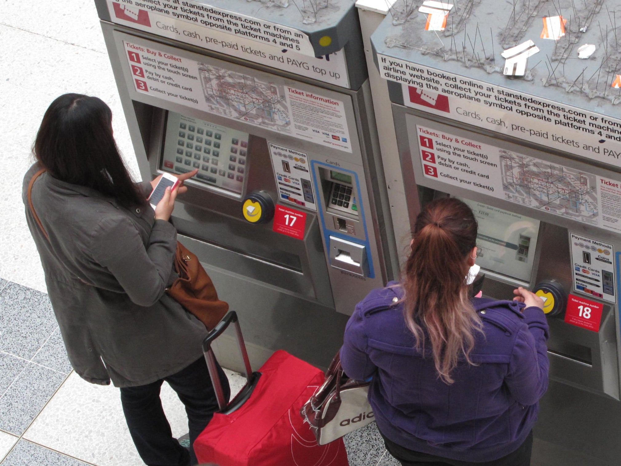 Price sensitive: passengers using ticket machines at a London station