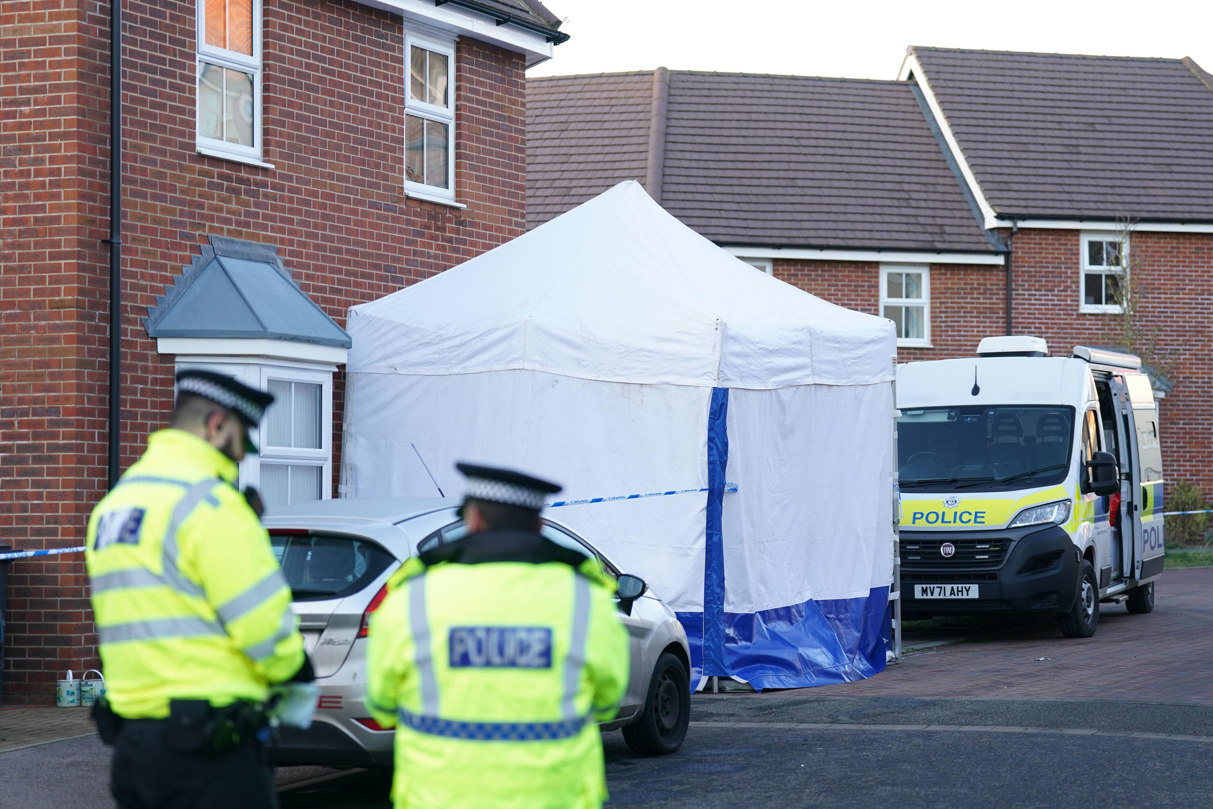 Police outside a house in Costessey near Norwich (PA)