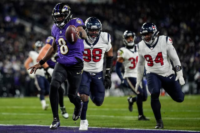 Baltimore Ravens quarterback Lamar Jackson runs into the end zone for a touchdown against the Houston Texans (Nick Wass/AP)