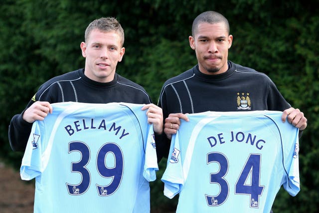 Nigel de Jong, right, and Craig Bellamy, left, joined Manchester City in January 2009 (Martin Rickett/PA)