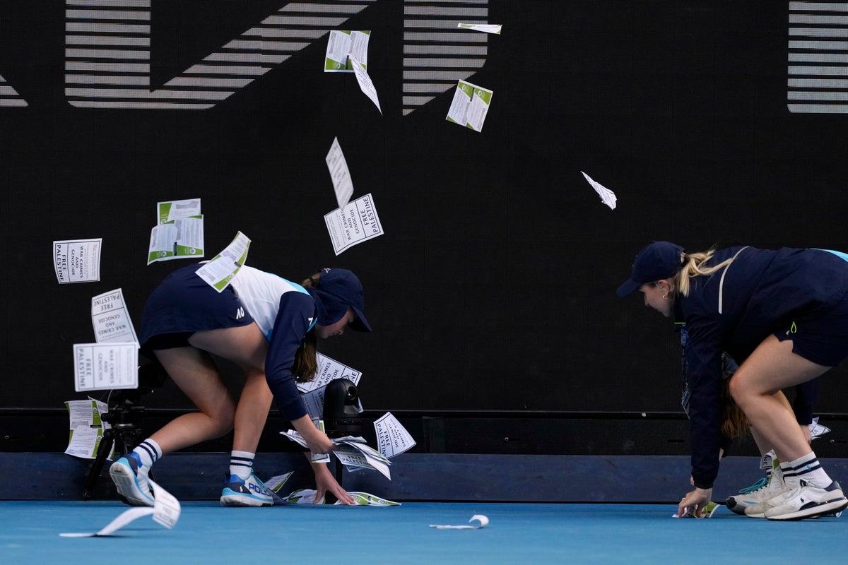 Protestor throws papers on court, briefly delaying Australian Open match between Zverev and Norrie