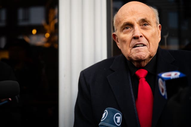 <p>Rudy Giuliani speaks to members of the media on  21 January 2024 in Manchester, New Hampshire</p>