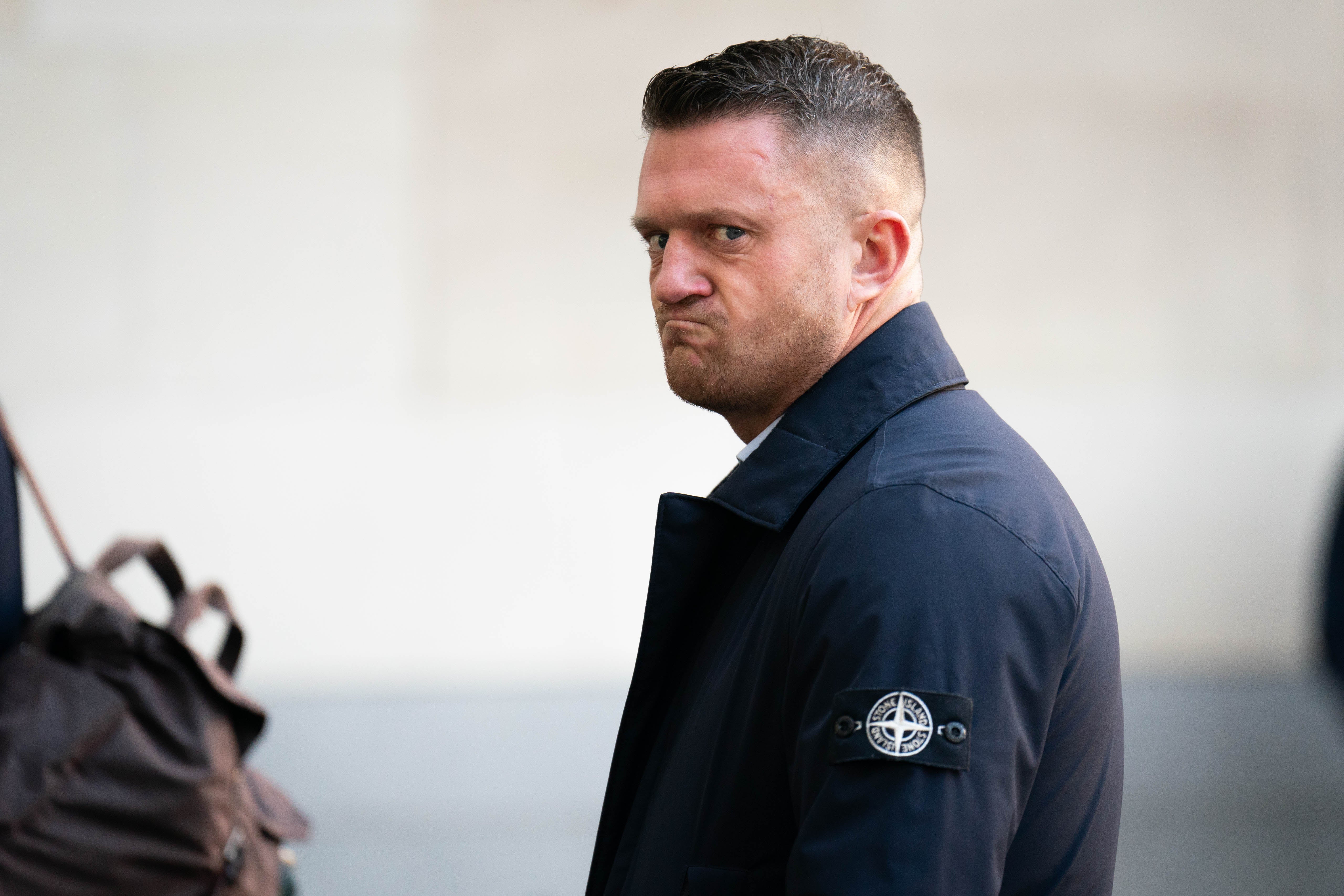 <p>Tommy Robinson, whose real name is Stephen Yaxley Lennon, arriving at Westminster Magistrates' Court</p>
