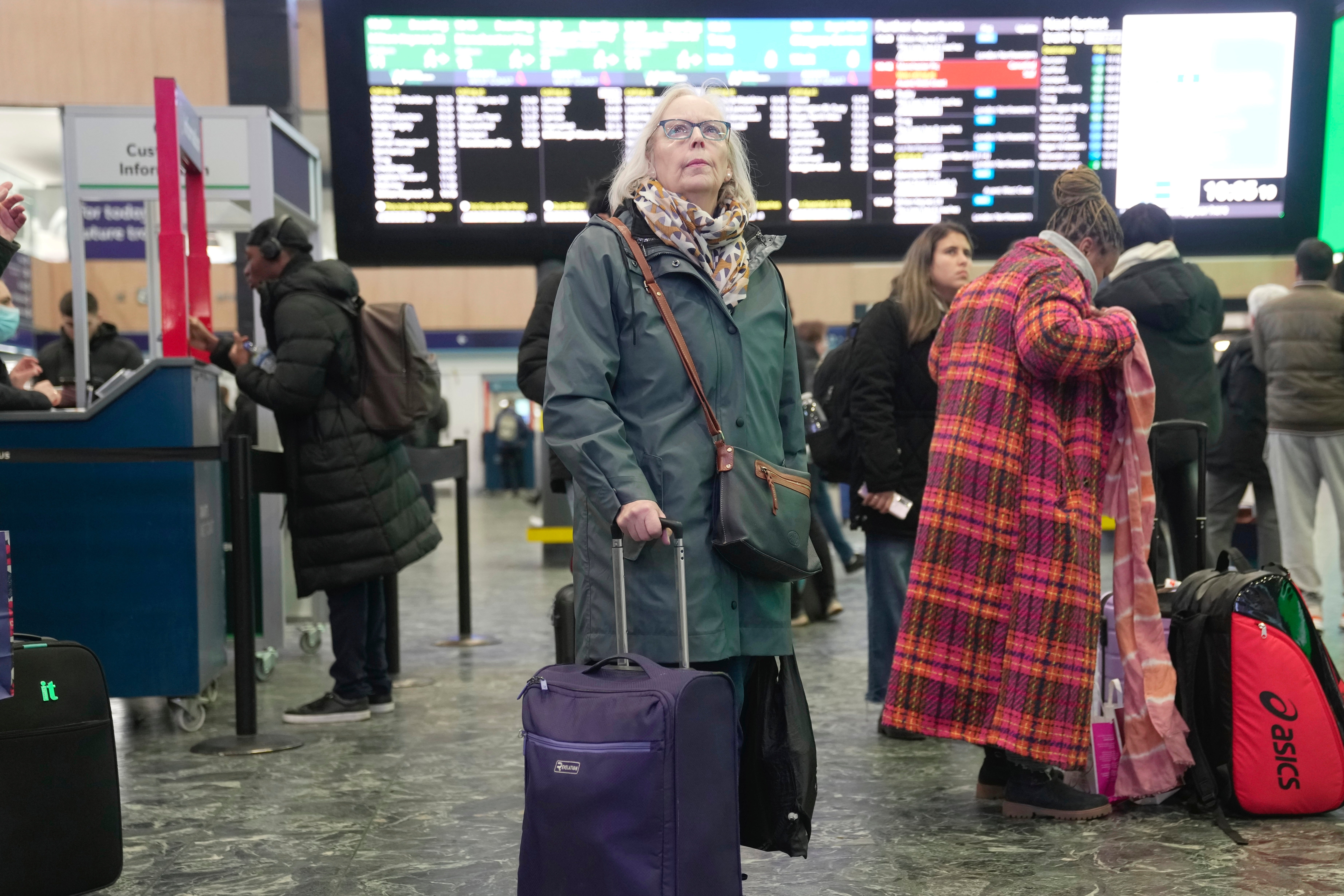 Passengers wait at the Euston Station in London, Monday, January 22, 2024