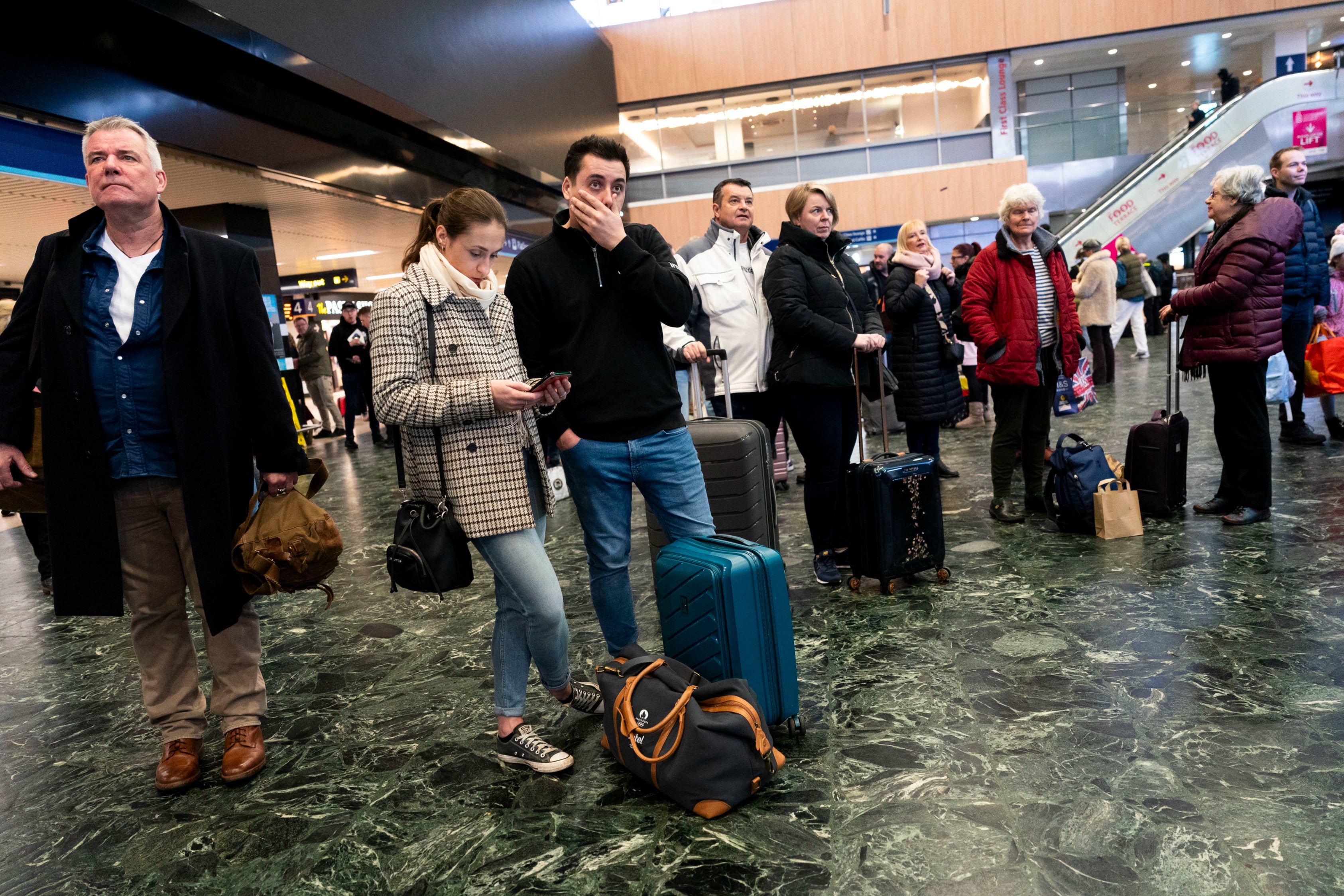Passengers at Euston station in London facing delays to trains as the Uk is hit by Storm Isha