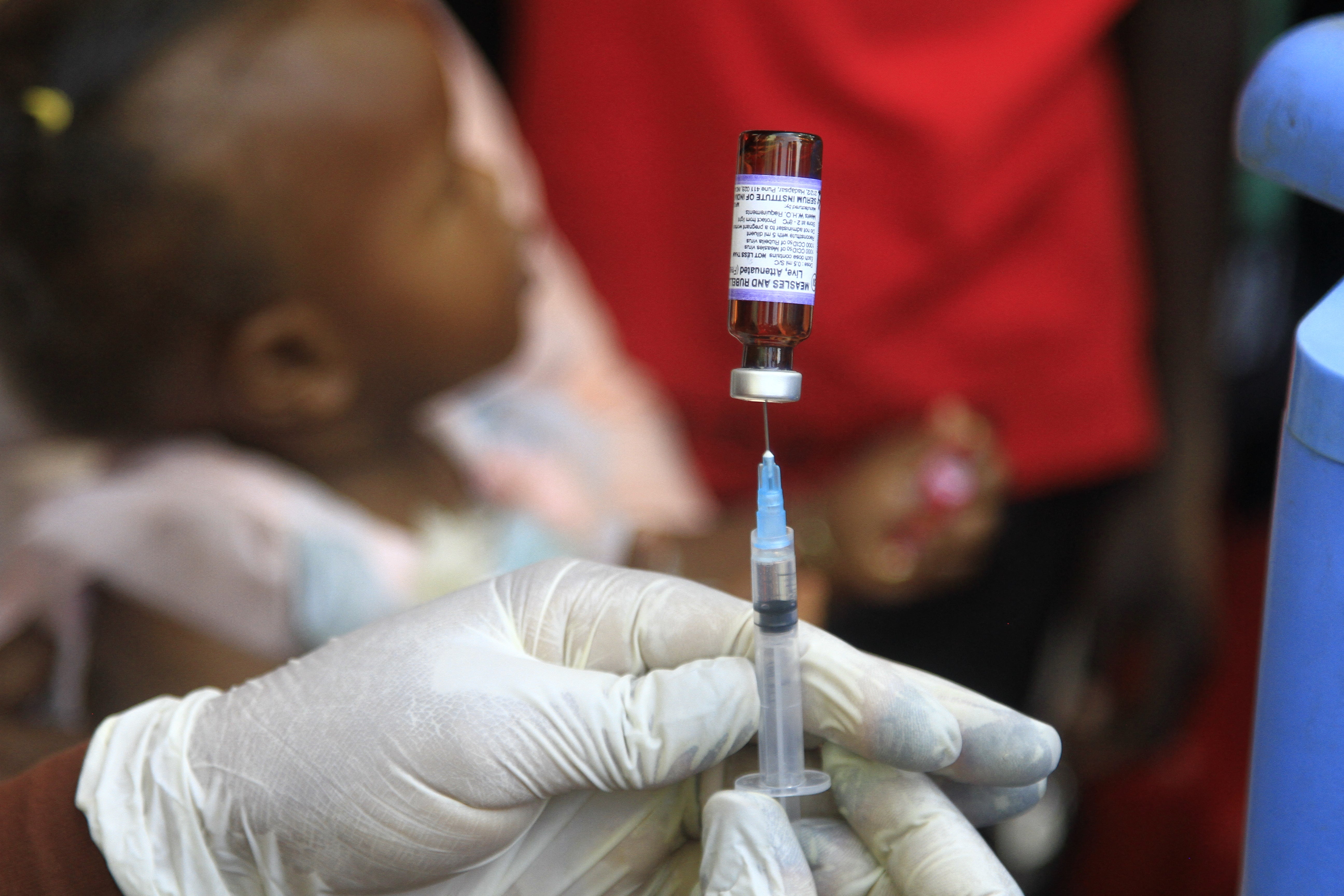 A Sudanese nurse prepares a vaccine shot in Sudan's Gedaref city on January 22, 2024