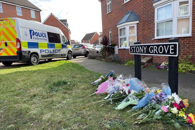 Floral tributes have been left near to the house in Allan Bedford Crescent in Costessey, Norfolk (Sam Russell/PA)