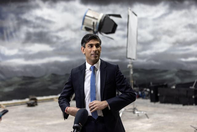 <p>Prime Minister Rishi Sunak in front of a painted backdrop of a stormy sky (Richard Pohle/The Times/PA)</p>