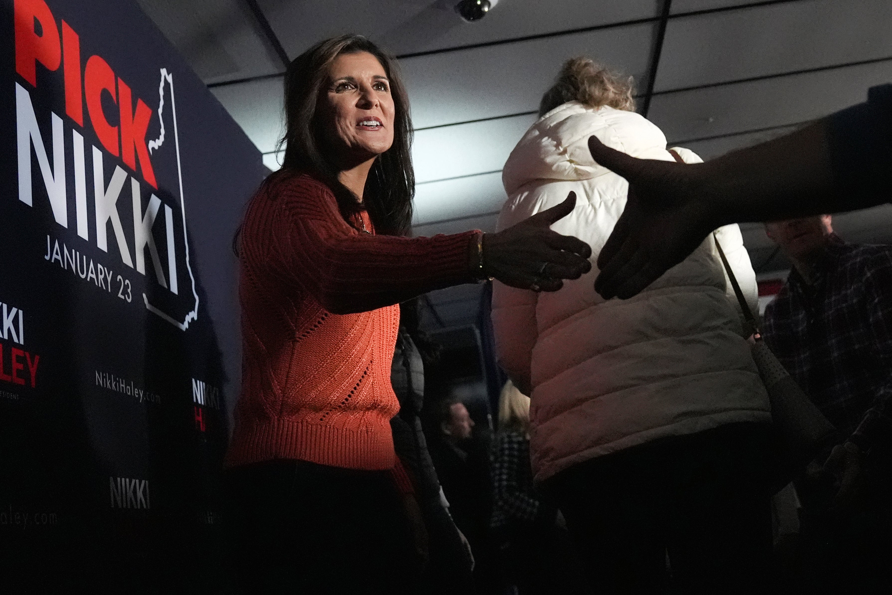 Republican presidential candidate former UN Ambassador Nikki Haley shakes hands with guests at a V.F.W. hall during a campaign stop, Monday, Jan. 22, 2024, in Franklin, N.H.