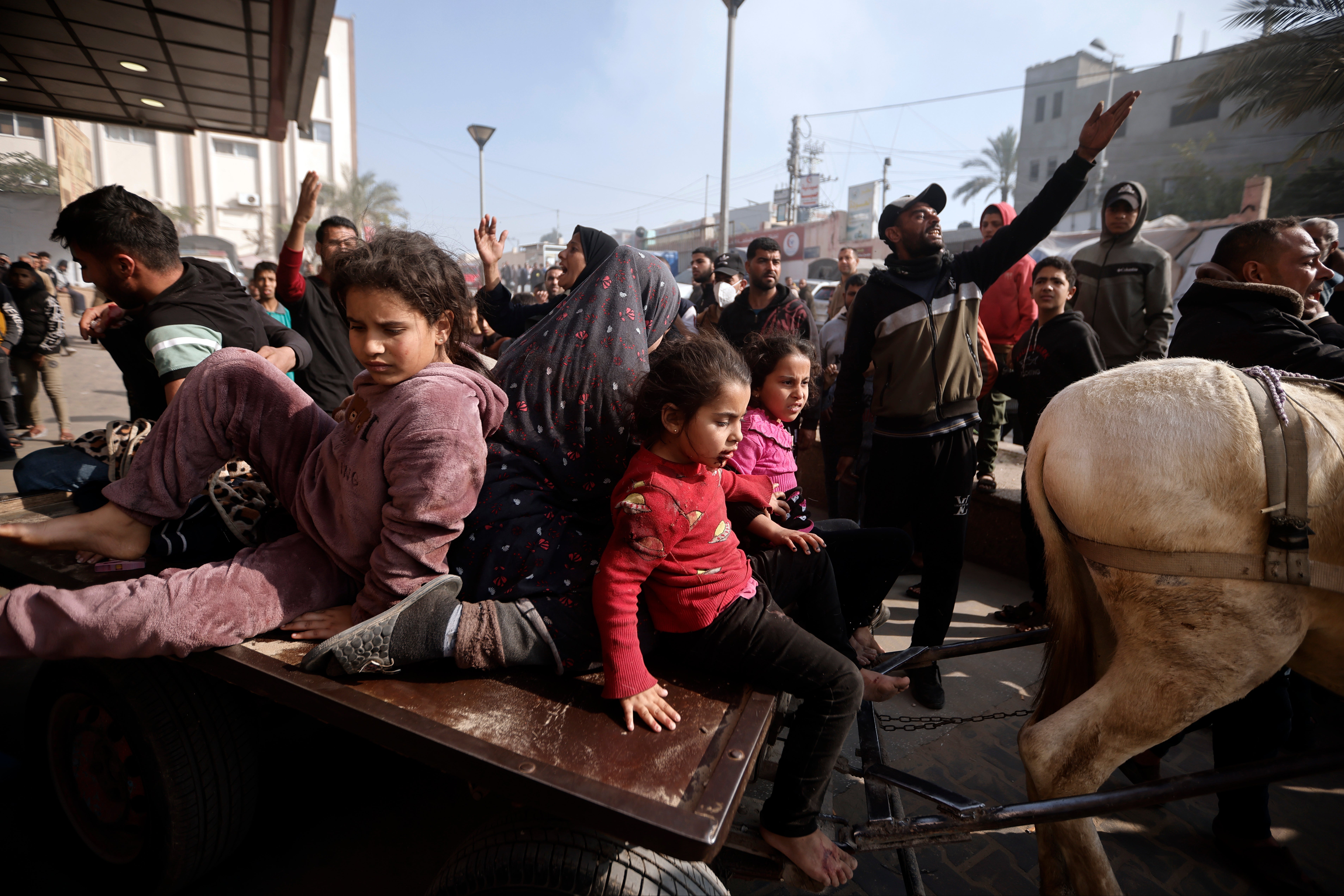 Palestinians outside the Nasser Hospital in Khan Younis as heavy fighting continues in southern Gaza