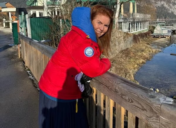 Alongside her words, the duchess shared a photo of herself smiling and dressed in a vivid red warm winter coat while leaning on a small bridge over a river, apparently in Austria