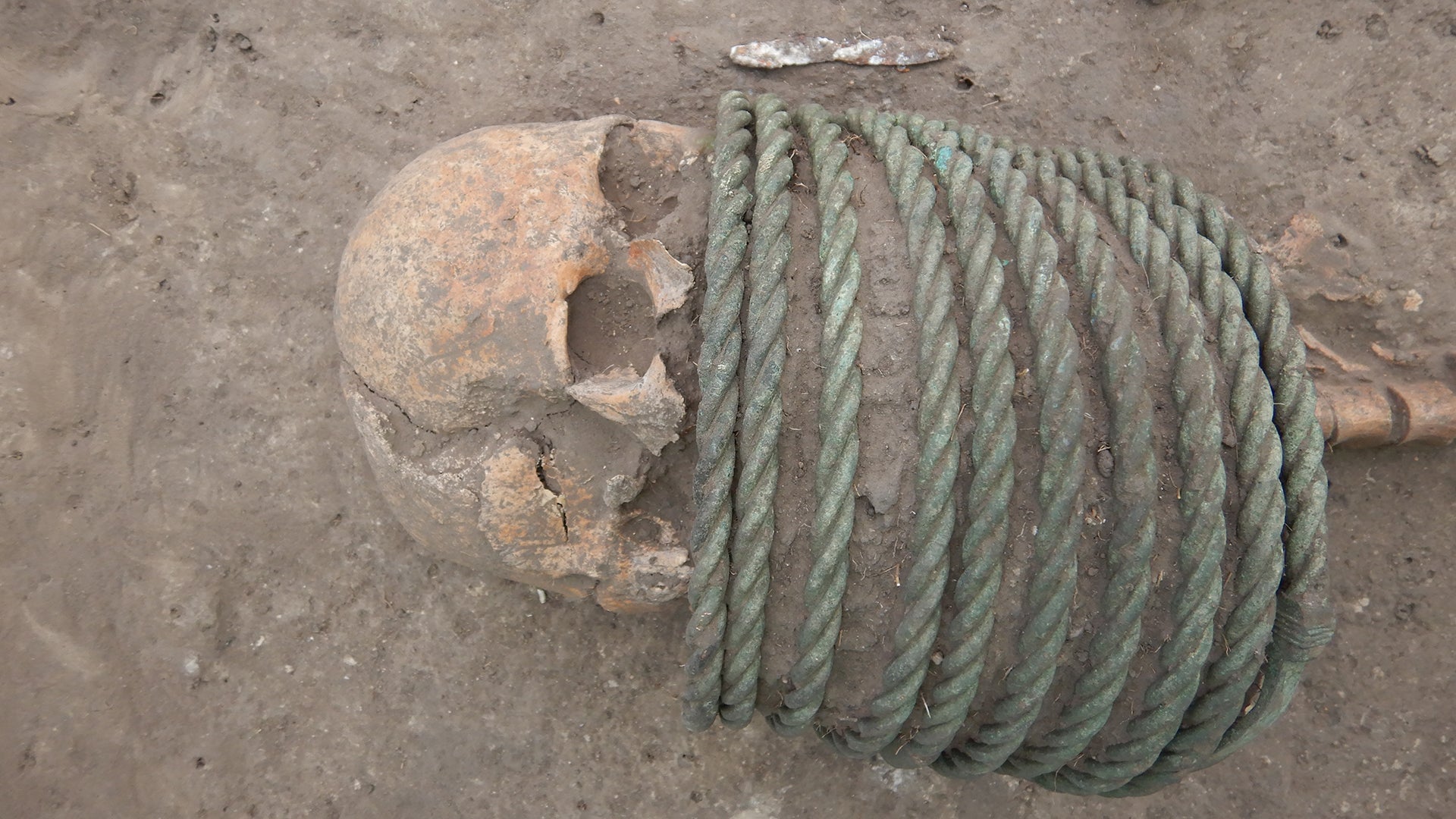 Skeletons in the 1000-year-old grave were found with rings around their necks