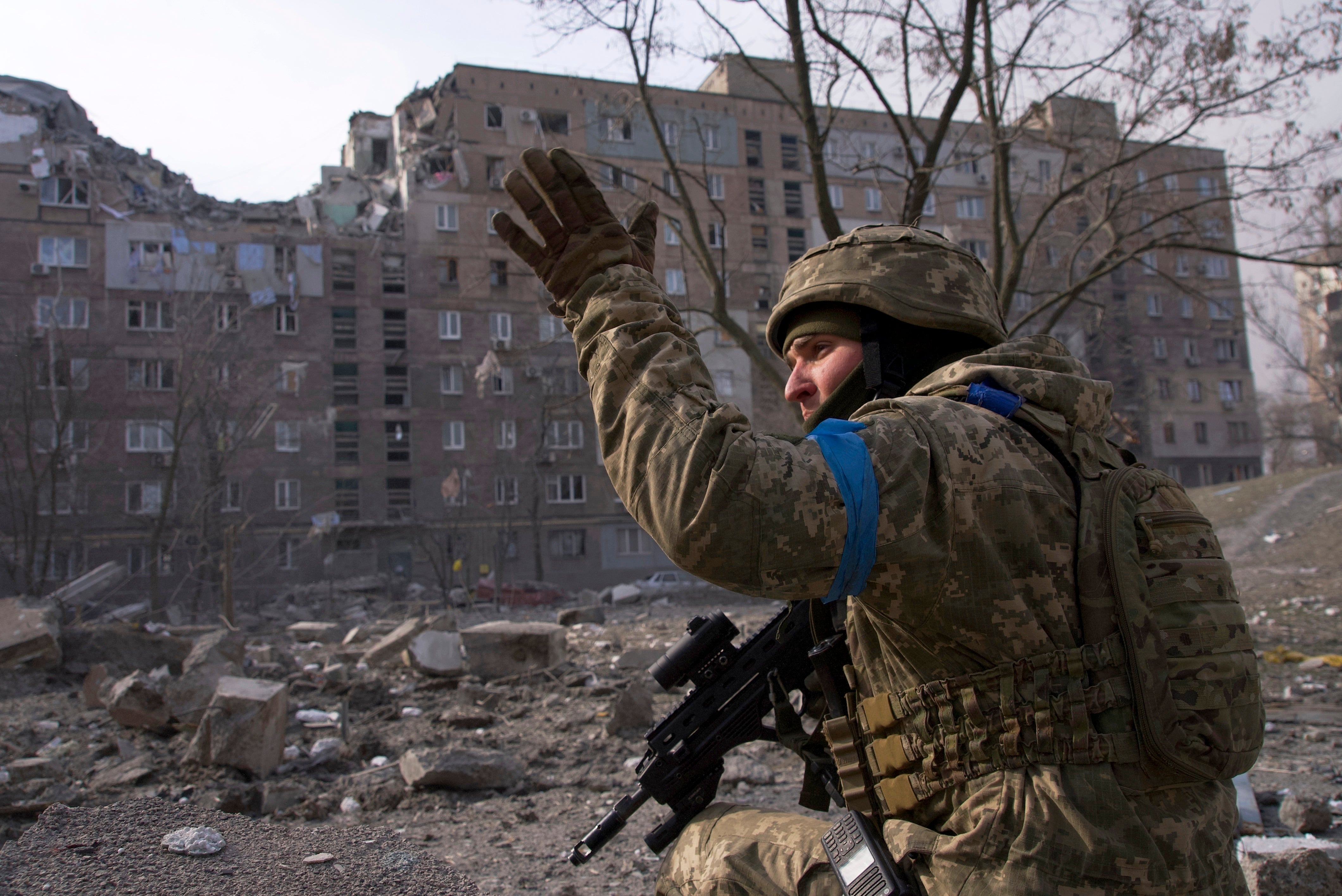 A Ukrainian serviceman guards his position in Mariupol in March 2022