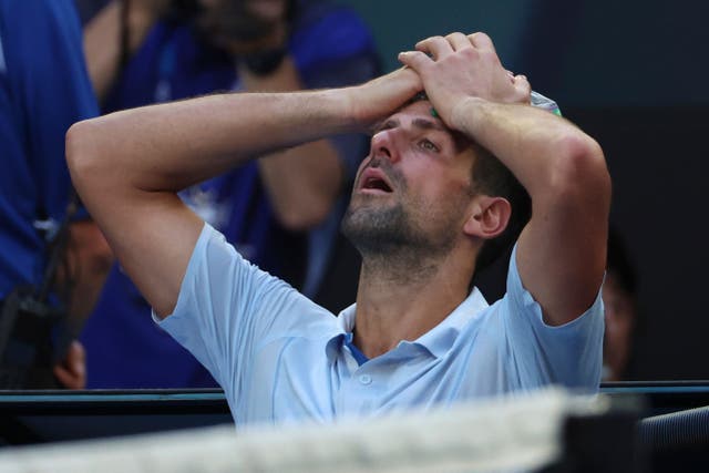 Novak Djokovic places a bag of ice on his head (Asanka Brendon Ratnayake)