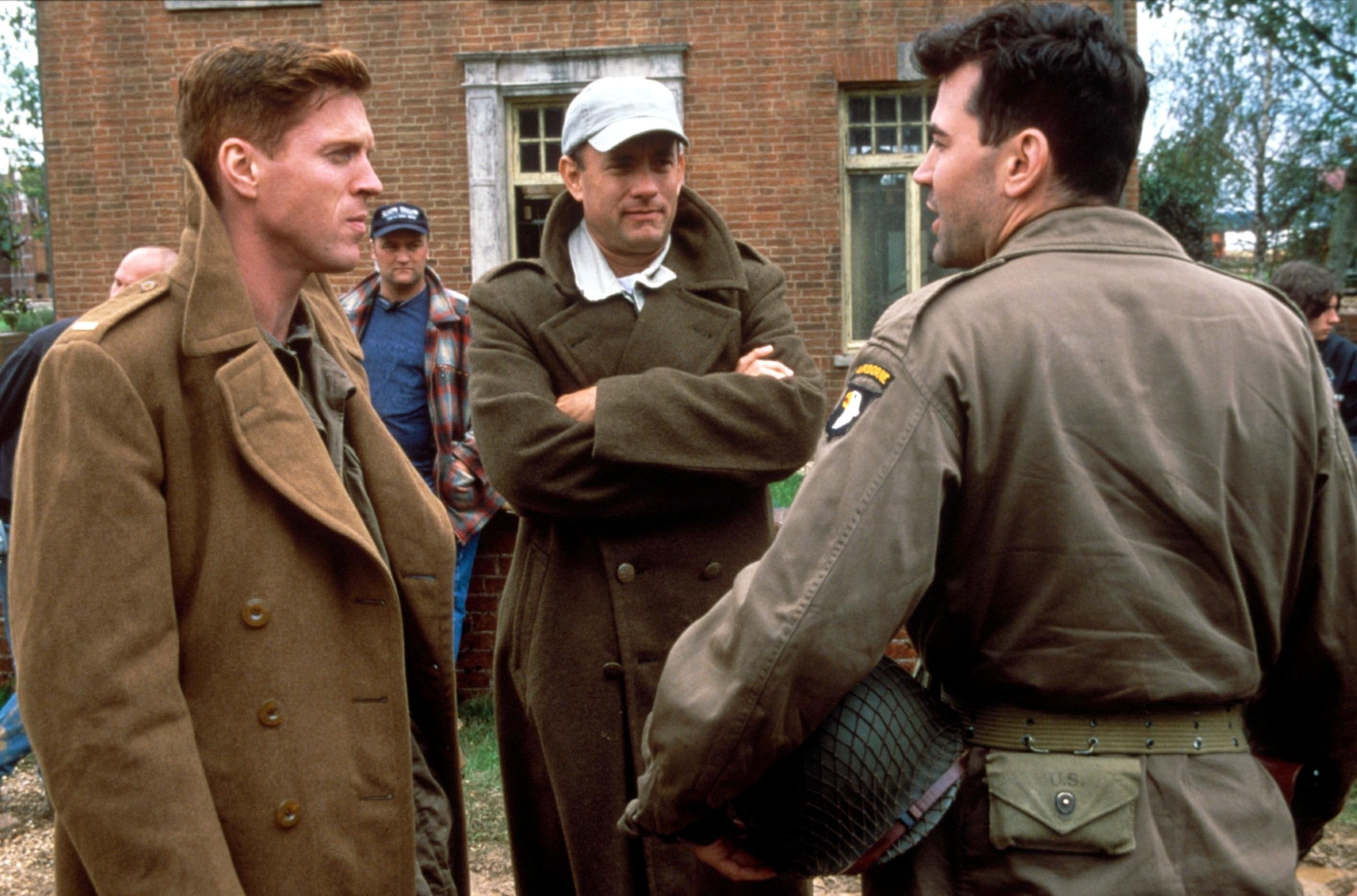 Damian Lewis, Tom Hanks and Ron Livingston on the set of ‘Band of Brothers'