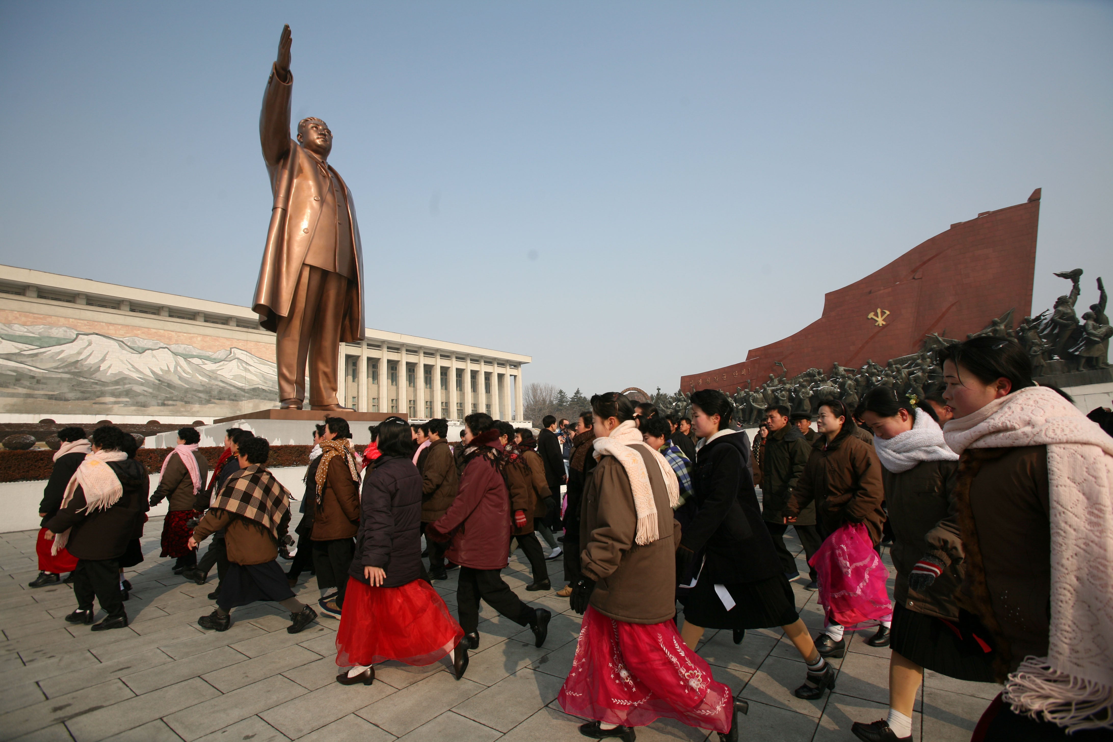 North Koreans visit a monument for Kim Il Sung in Pyongyang, North Korea on Tuesday, Feb. 26, 2008.