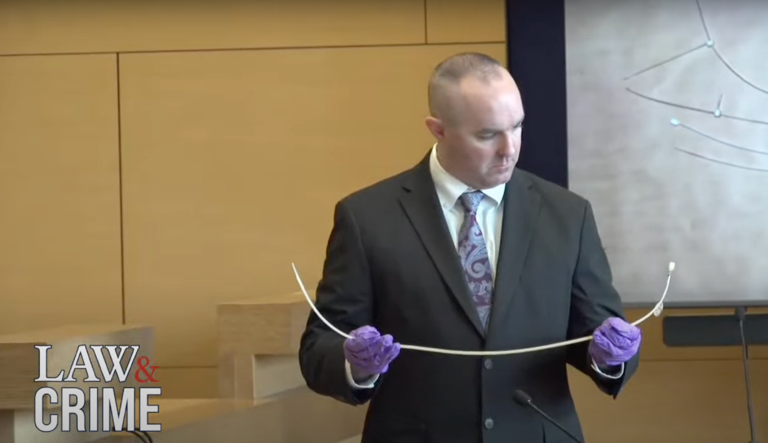 Sgt Kevin Duggan holds up bloody zip ties at Michelle Troconis’ trial