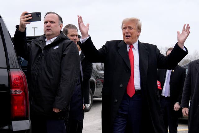 <p>Republican presidential candidate former President Donald Trump, right, greets supporters as he arrives at a campaign stop in Londonderry, N.H., Tuesday, Jan. 23, 2024.</p>