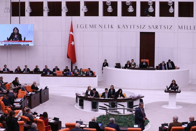 <p>Members of Turkish parliament attend session before voting on a bill regarding Sweden's accession to Nato, at the Grand National Assembly of Turkey (TBMM) in Ankara</p>
