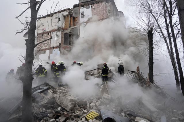 <p>Rescuers work at the scene of a building damaged by Russian rocket attack in Kharkiv, Ukraine</p>