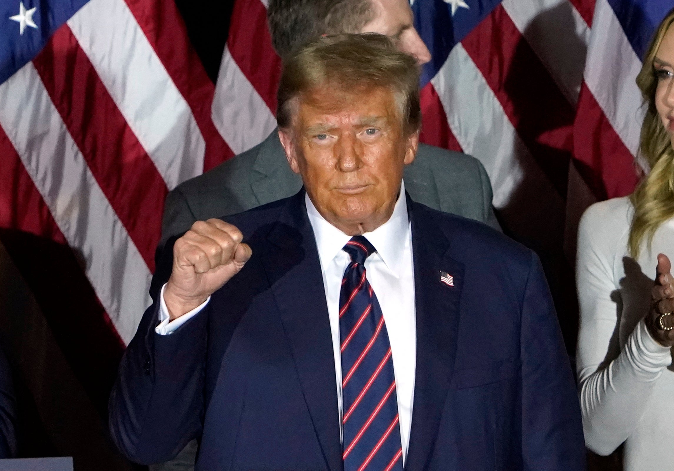 <p>Republican presidential hopeful and former US President Donald Trump gestures during an Election Night Party in Nashua, New Hampshire, on January 23, 2024. </p>