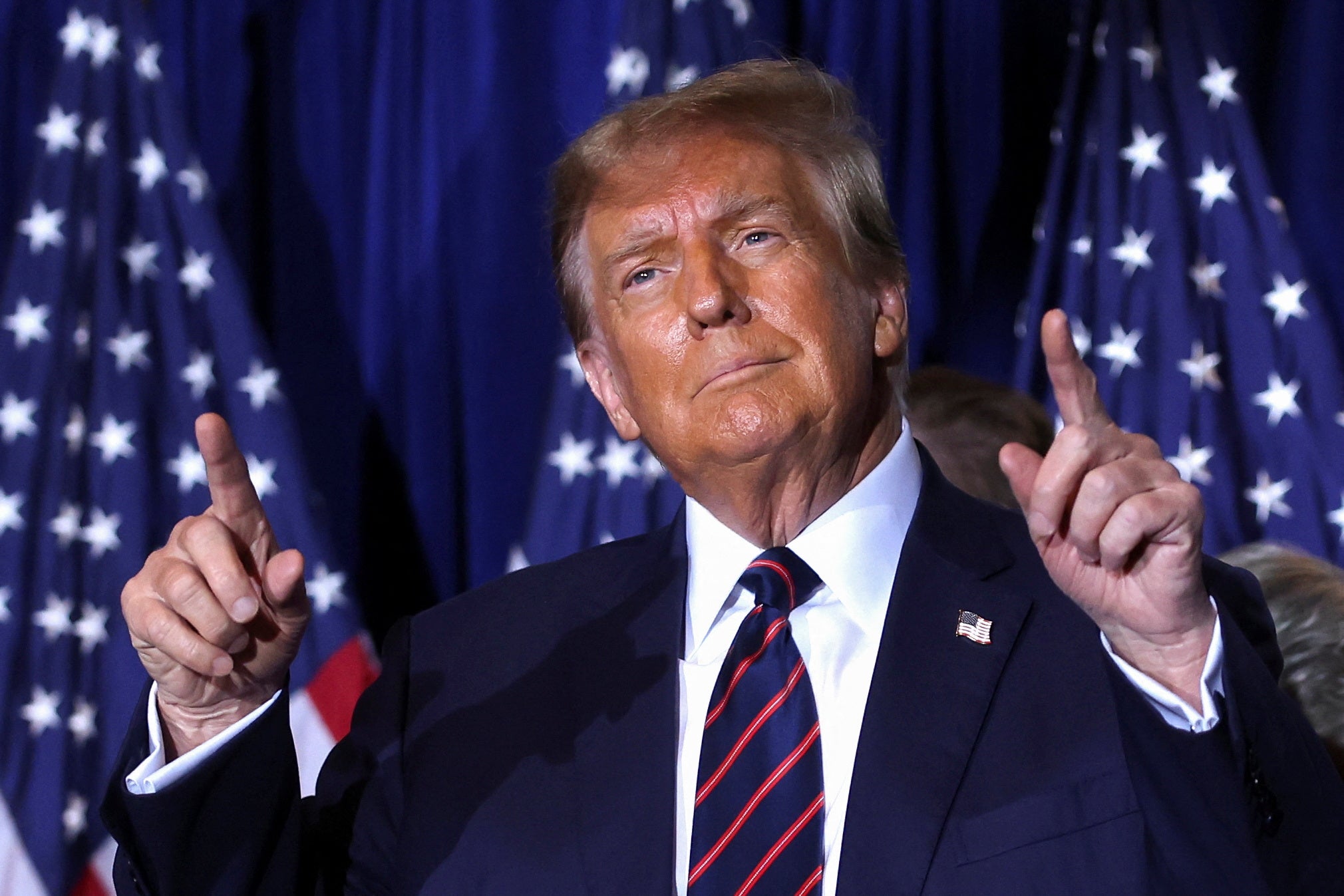 <p>Republican presidential candidate and former U.S. President Donald Trump gestures as he takes the stage during his New Hampshire presidential primary election night watch party, in Nashua, New Hampshire, U.S., January 23, 2024. REUTERS/Mike Segar</p>