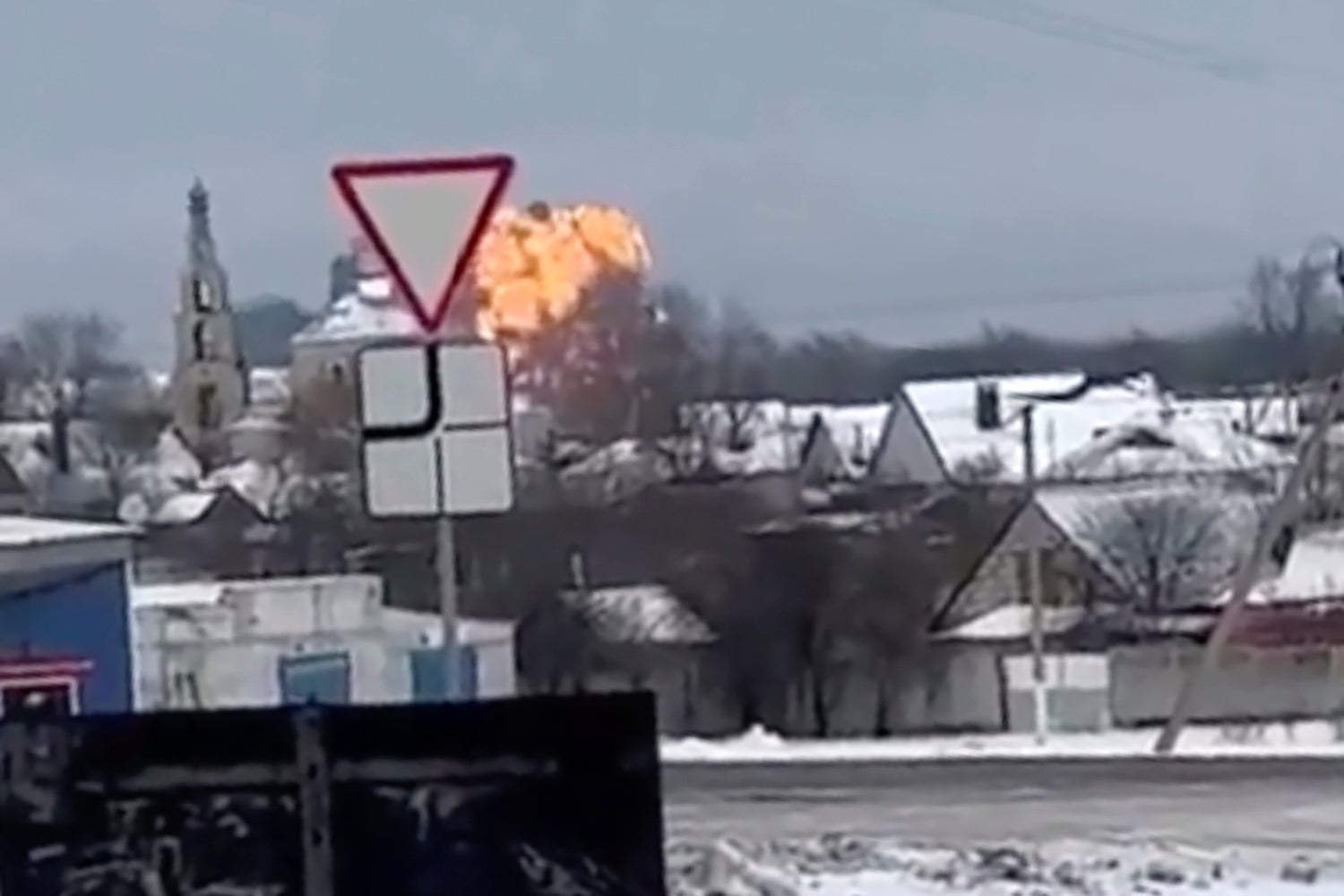 <p>In this handout photo taken from validated UGC video show flames rising from the scene of a warplane crashed at a residential area near Yablonovo, Belgorod region</p>