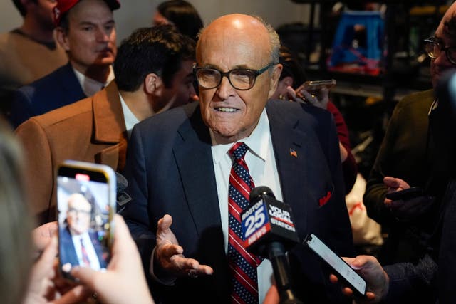<p>Rudy Giuliani speaks to reporters after Republican presidential candidate former President Donald Trump spoke at a primary election night party in Nashua, N.H., Tuesday, Jan. 23, 2024. (AP Photo/Matt Rourke)</p>