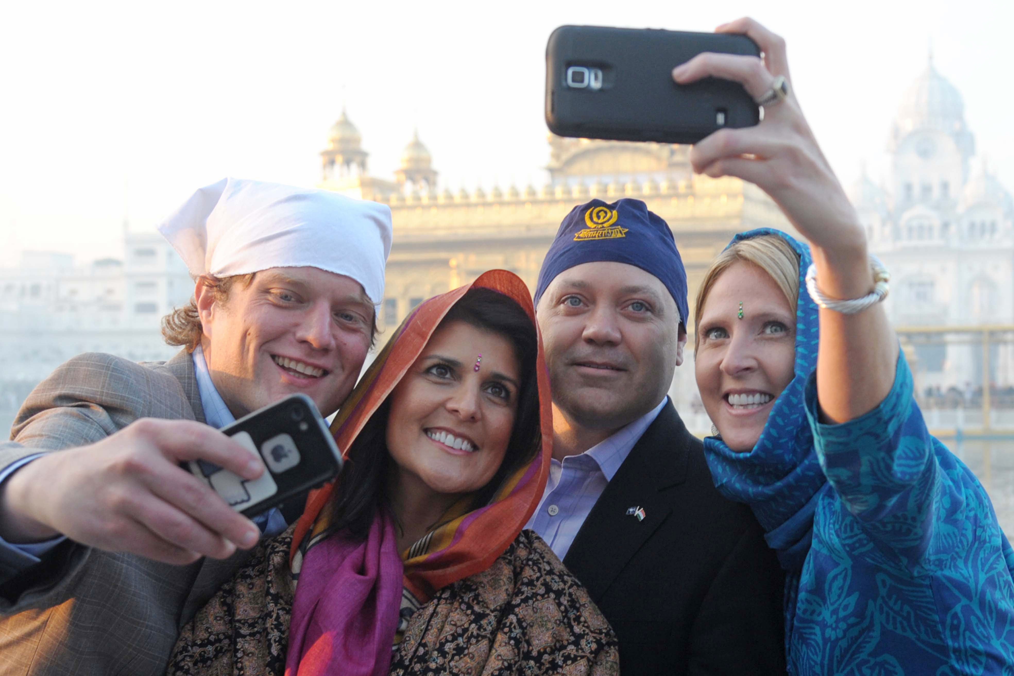 Haley with her husband Michael, second right, and officials at the Golden Temple in Amritsar, 2014