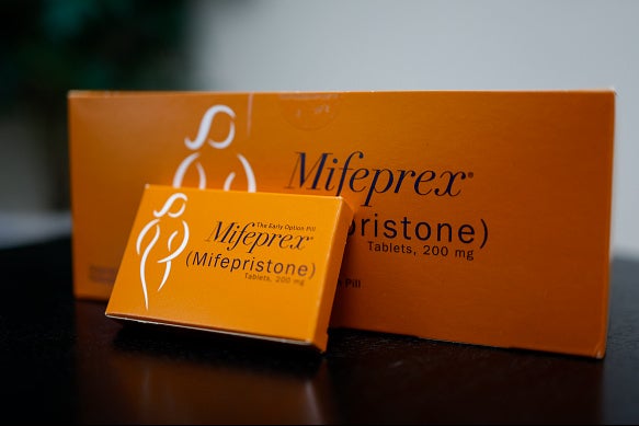 In this photo illustration, packages of Mifepristone tablets are displayed at a family planning clinic on April 13, 2023