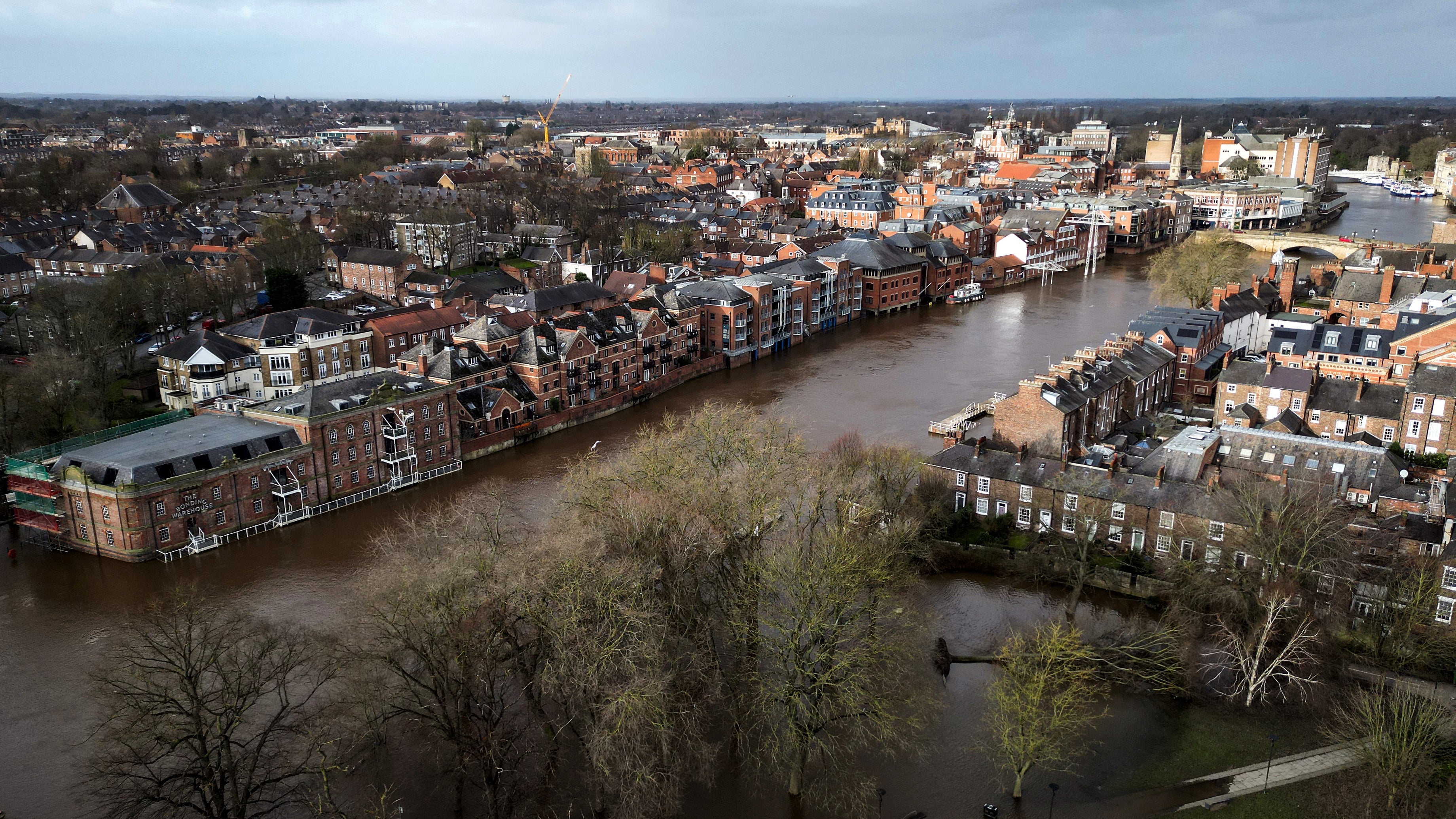 An aerial picture taken on January 24, 2024 shows a fallen tree laying down in water following the bursting of the banks of the River Ouse following storm Jocelyn