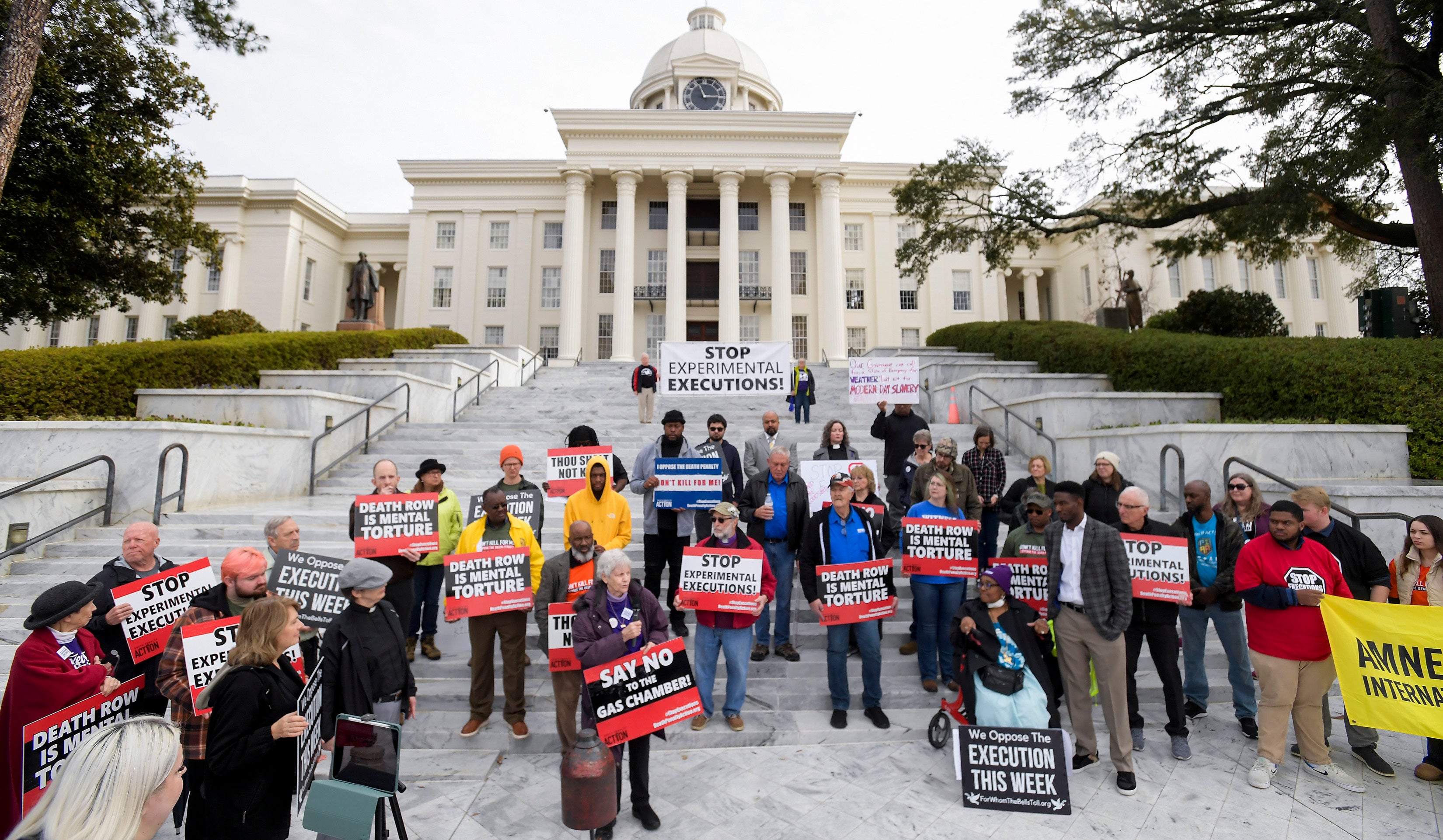 Nearly 100 protestors gather at the state capitol building in Montgomery, Alabama, on 23 January to call for Smith’s execution to be stayed