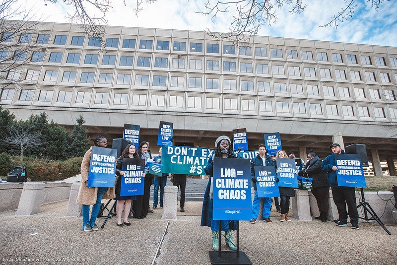 Frontline activists from Louisiana and national environmental organizations gather outside the Department of Energy in November 2023 to deliver 200,000+ petition signatures demanding the Biden administration halt permitting and construction of over 20 proposed liquefied natural gas (LNG) export facilities across the Gulf region