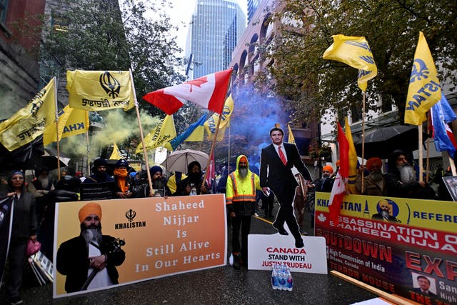 <p>Flags and signs are seen as demonstrators protest outside India’s consulate, a week after Canada’s prime pinister Justin Trudeau raised the prospect of New Delhi’s involvement in the murder of Sikh separatist leader Hardeep Singh Nijjar in 2023</p>
