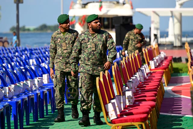 <p>File: Maldives’ army soldiers use a metal detector to secure an area ahead of the inaguration of Maldives’ president-elect Mohamed Muizzu ahead of the inauguration ceremony in Male</p>