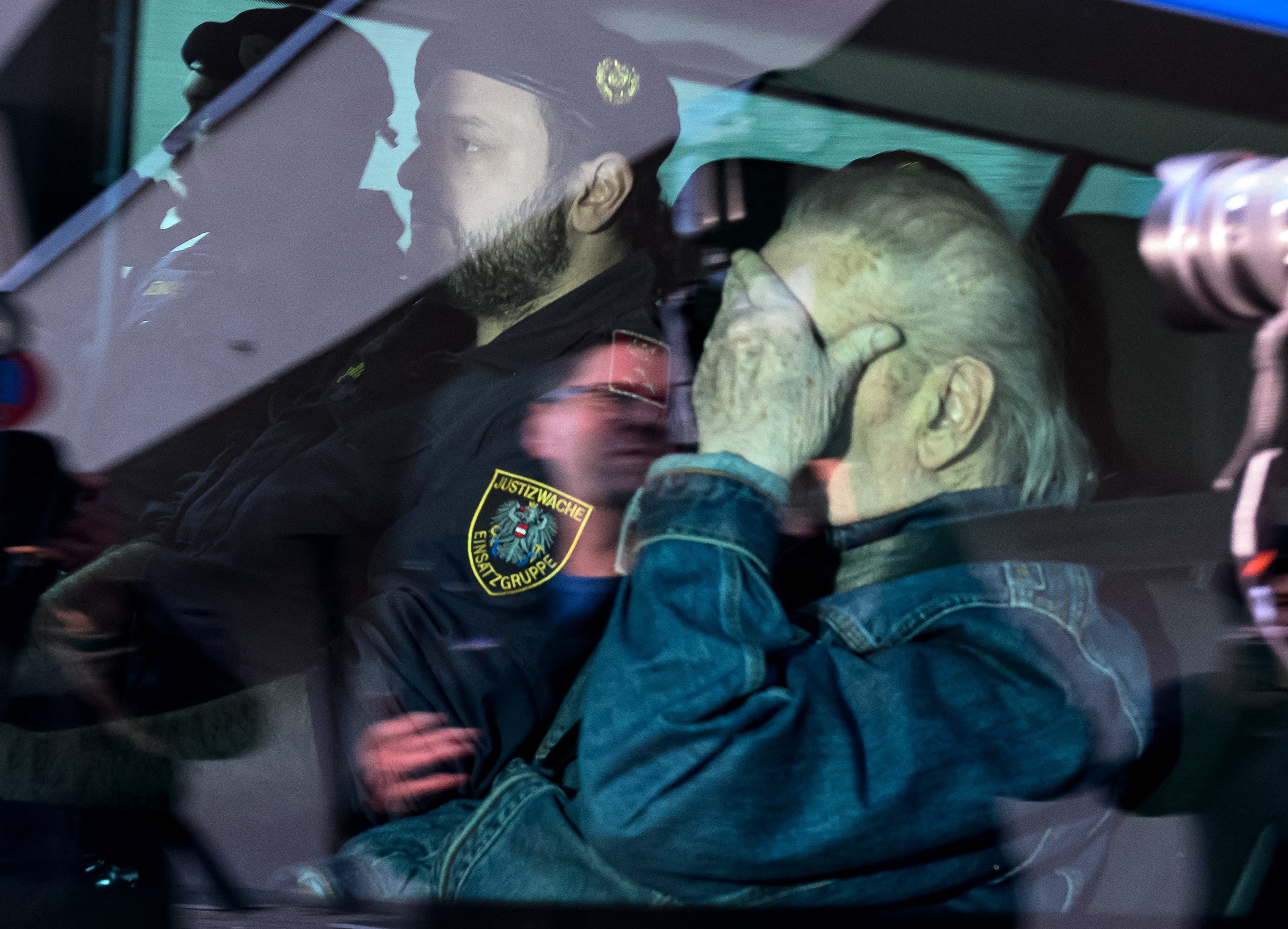Austrian Josef Fritzl, who imprisoned his daughter in a cellar for over 24 years and fathered seven children with her, is escorted back to a prison